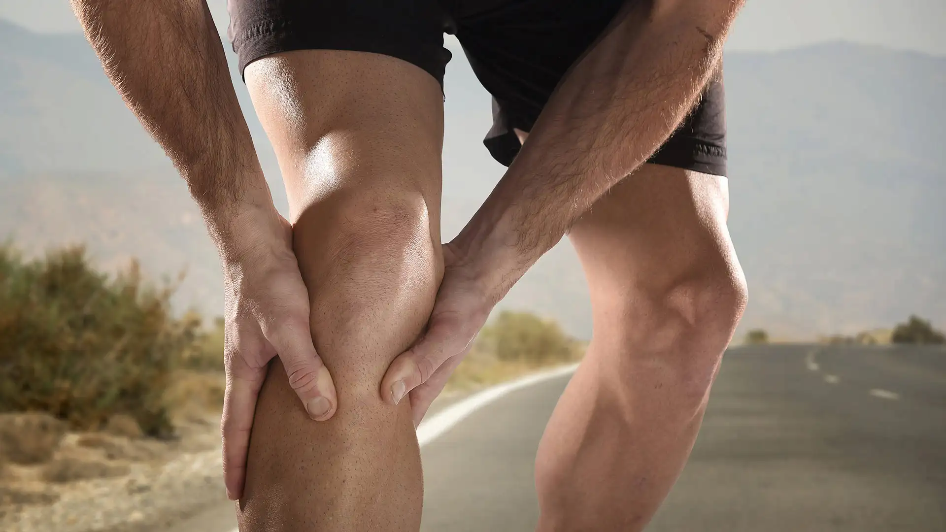 Joint Pain - Advanced Pain Medical Group Photo Of A Female Runner On The Ground, Holding Her Knee In Pain. Get Joint Pain Treatment With Advanced Pain Medical.