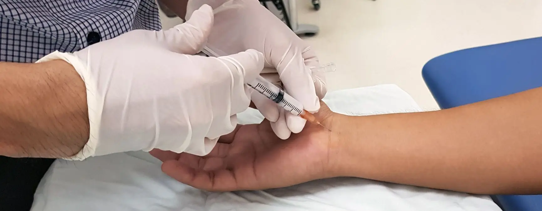 Person receiving an injection in the wrist to help alleviate carpal tunnel.