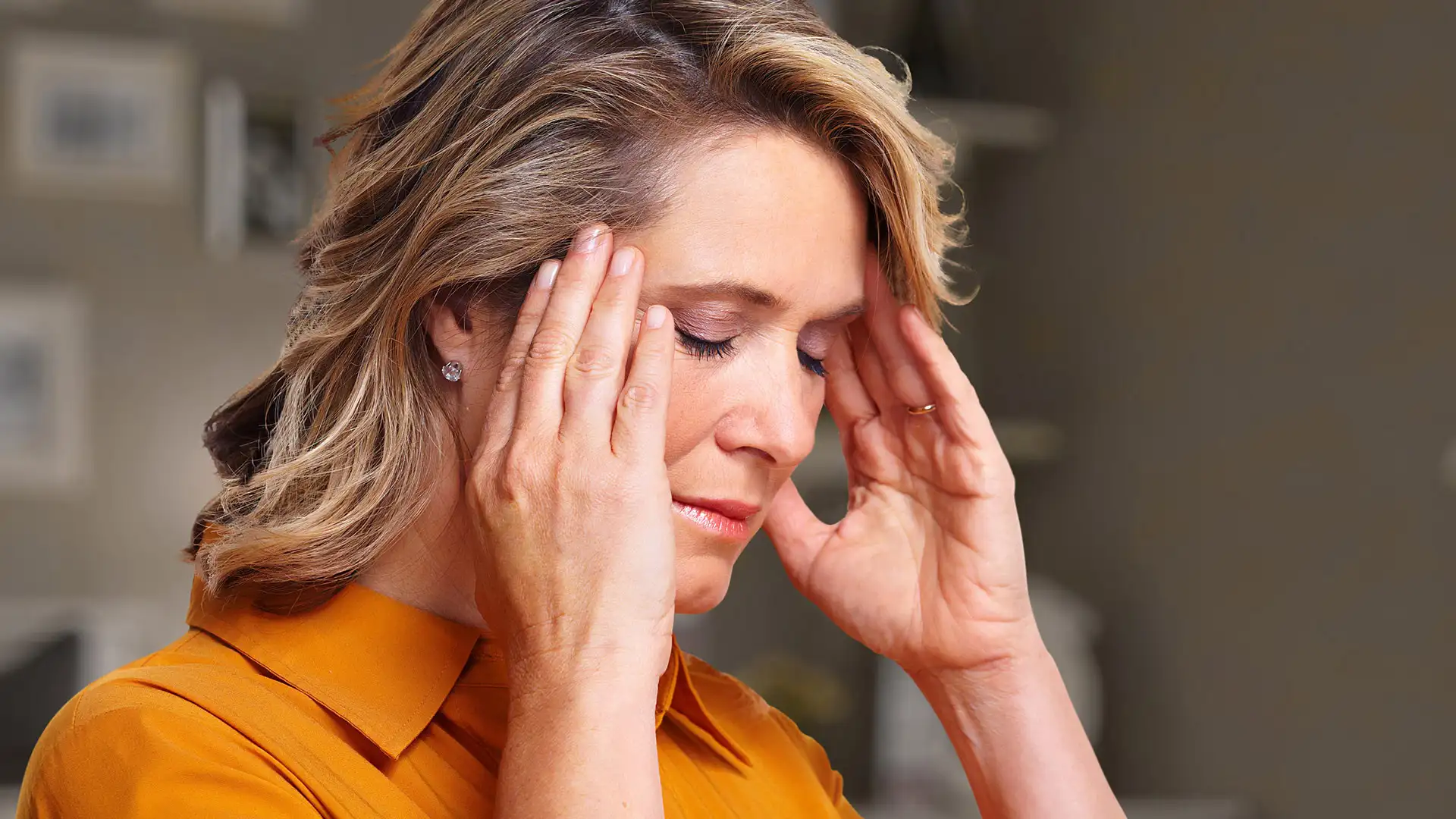 Woman experiencing headache and stress